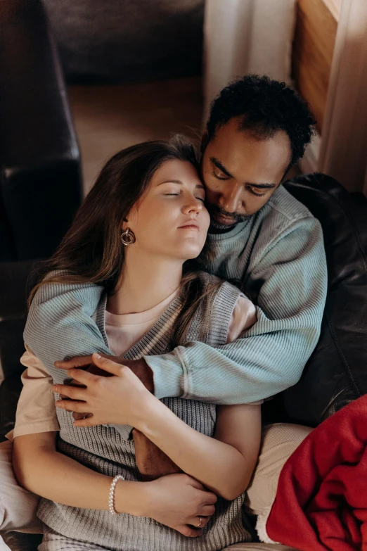 a man and a woman cuddle on a couch, trending on pexels, renaissance, mixed race, 256435456k film, instagram photo, soft portrait shot 8 k