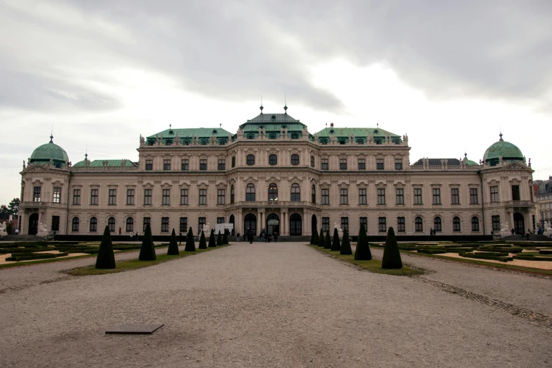 a large stone building with a green roof, inspired by Károly Markó the Elder, pexels contest winner, rococo, vienna secesion style, view from front, square, grey