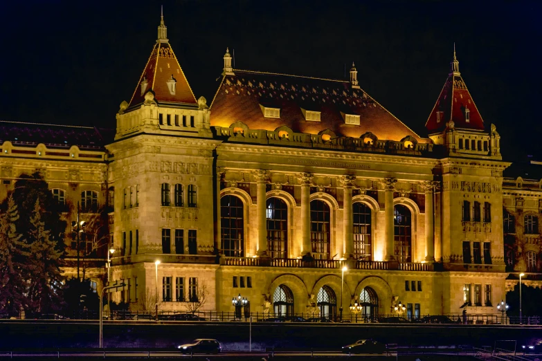 a large building that is lit up at night, inspired by Mihály Munkácsy, profile image, listing image, old library, exterior photo