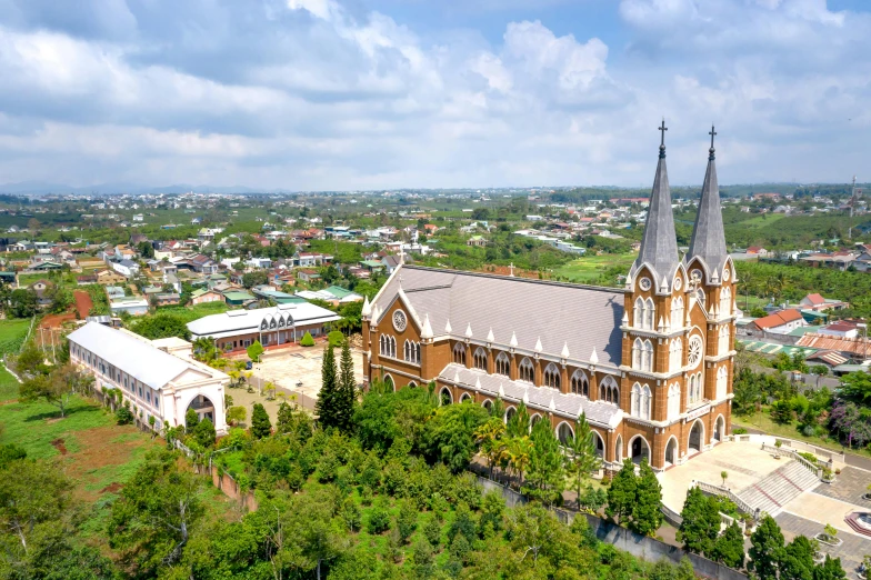 an aerial view of a church surrounded by trees, sumatraism, in a city with a rich history, profile image, fan favorite, private school