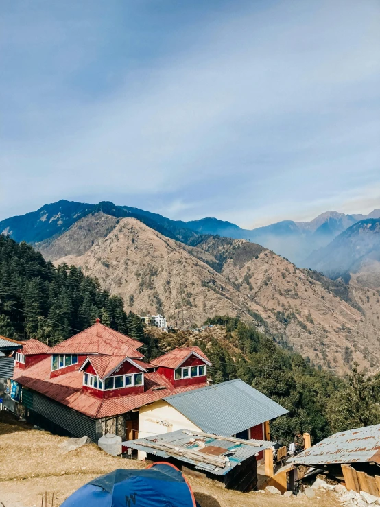 a group of tents sitting on top of a mountain, nepali architecture buildings, profile image, lush surroundings, promo image