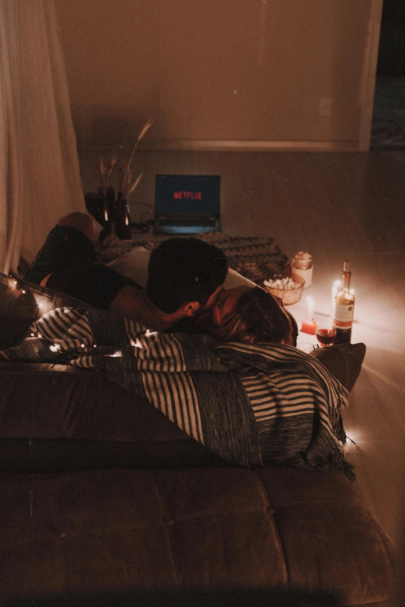 a couple of people laying on top of a bed, unsplash contest winner, romanticism, movie setup, candlelit, profile image, unedited