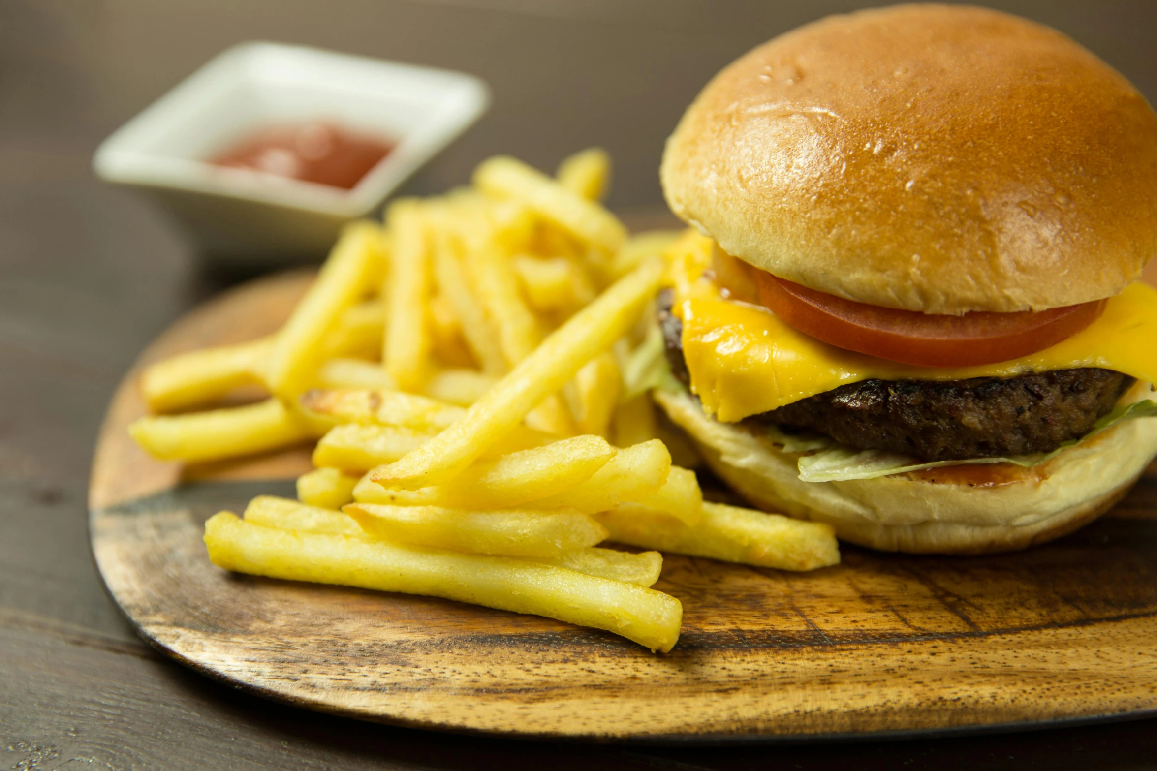 a cheeseburger and french fries on a cutting board, a picture, unsplash, renaissance, close-up photo, fan favorite, hasselblatt, children's