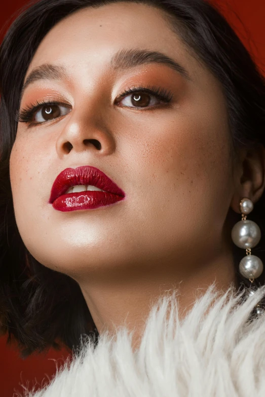 a close up of a woman wearing a fur coat, inspired by Natasha Tan, thick red lips, young asian woman, square, shot with sony alpha