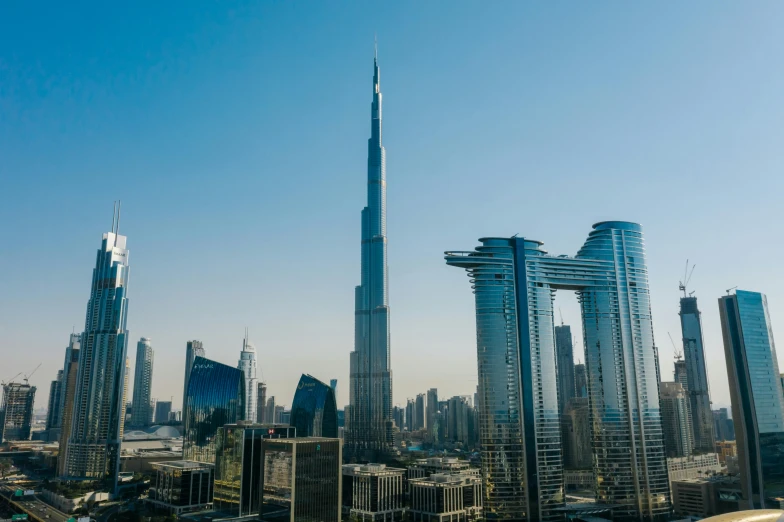 the burjra tower towering over the city of dubai, pexels contest winner, industrial giant skyscrapers, thumbnail, high resolution, 1 4 8 0 s