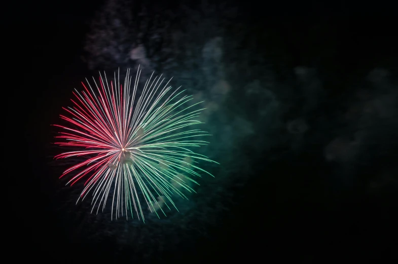 a colorful fireworks is lit up in the night sky, a digital rendering, by Stefan Gierowski, pexels, teal silver red, medium close up shot, shot on sony a 7, a green