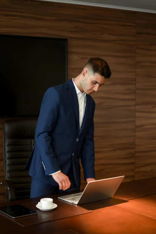 a man in a suit working on a laptop, trending on pexels, renaissance, standing on a desk, formal attire, girl in a suit, maintenance