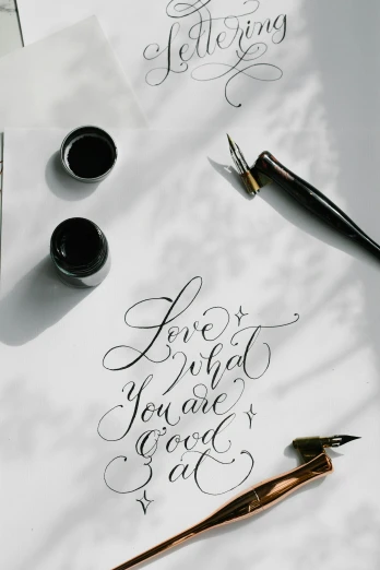 a close up of a sheet of paper with writing on it, an ink drawing, trending on pexels, lyco art, “modern calligraphy art, background image, love craft, poster