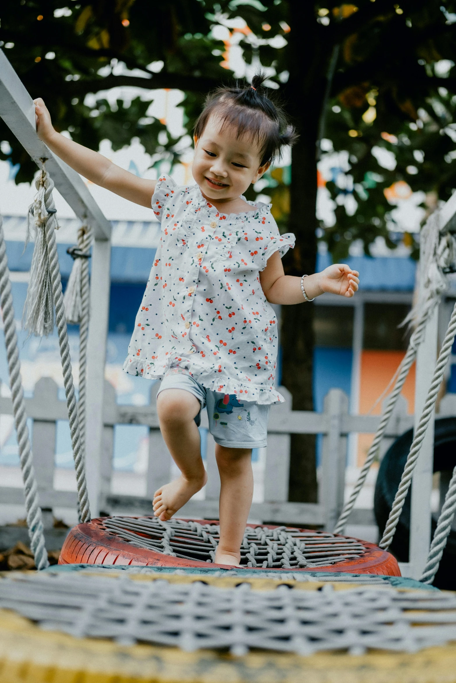 a little girl that is standing on a trampol, inspired by Myles Birket Foster, pexels contest winner, activity play centre, mai anh tran, jumping at the viewer, soft texture