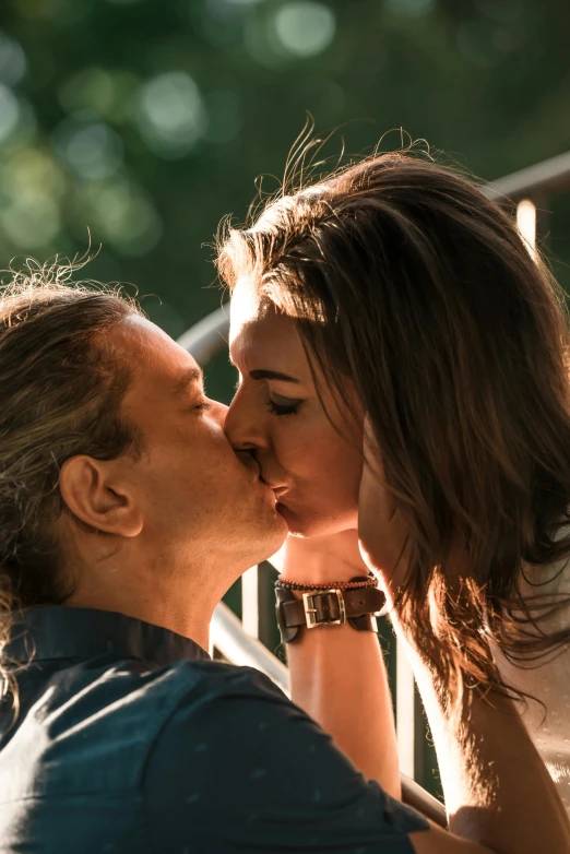 a woman giving a man a kiss on the cheek, pexels contest winner, film still from 'tomb raider', summer morning light, frank dillane, jesus kissing a maria maddalena