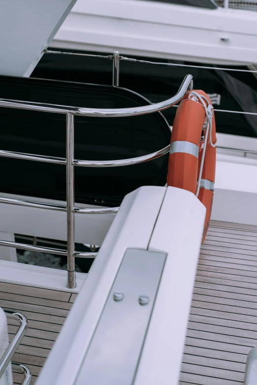 a boat with a life preserver on the deck, chrome tubes, on a super yacht, aesthetic details, guardrail