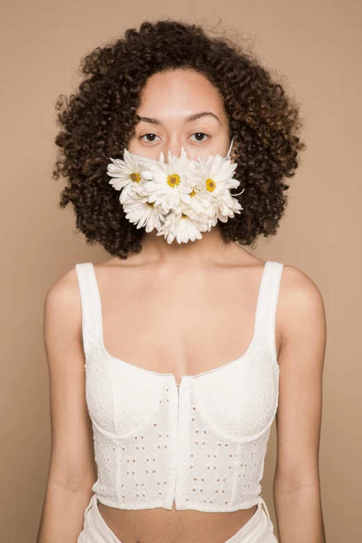 a woman with a flower in her mouth, inspired by Bert Stern, trending on pexels, aestheticism, white bra, brown curly hair, masks, tan complexion