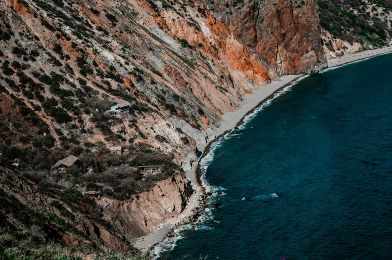 a large body of water next to a cliff, by Adam Marczyński, pexels contest winner, 2 5 6 x 2 5 6 pixels, black sea, landslides, ibiza