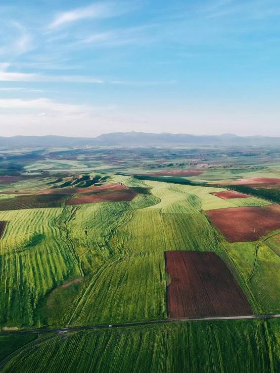 an aerial view of a field of crops, pexels contest winner, hills and mountains, 4 k cinematic panoramic view, 2 5 6 x 2 5 6 pixels, green eays