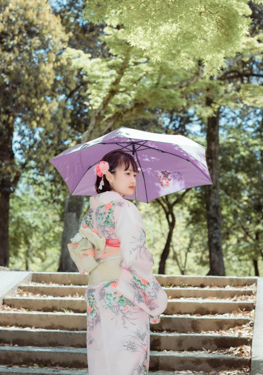 a woman in a kimono is holding an umbrella, inspired by Uemura Shōen, unsplash, low quality photo, outdoor photo, purple, 🚿🗝📝