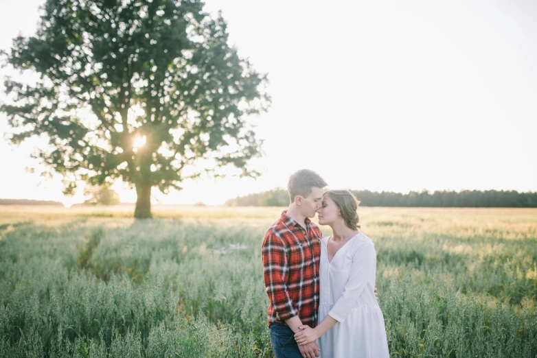 a man and woman standing next to each other in a field, a picture, by Kristin Nelson, unsplash, 2 5 6 x 2 5 6 pixels, spring evening, listing image, casey cooke