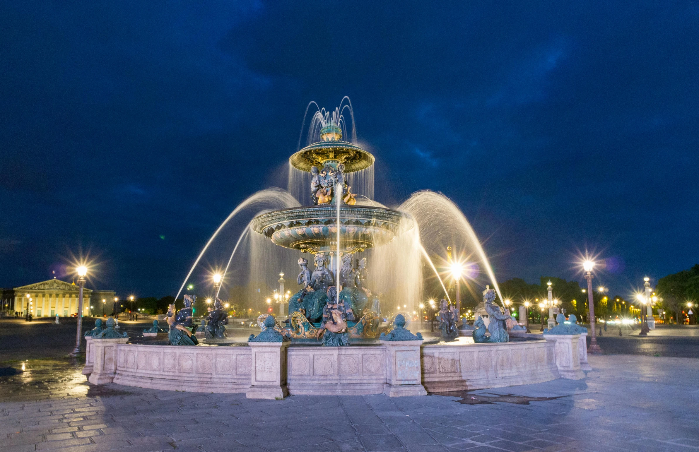 a fountain in the middle of a plaza at night, pexels contest winner, art nouveau, directoire style, gilt metal, arc, group photo