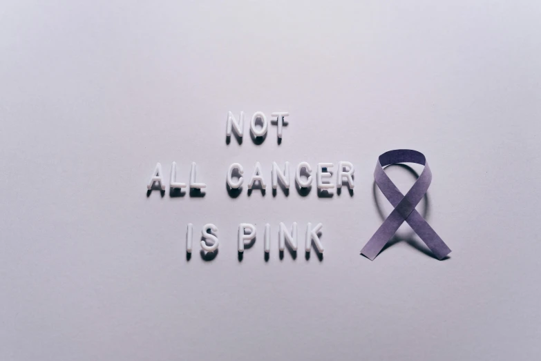 a sign that says not all cancer is pink, a photo, pexels contest winner, antipodeans, ribbon, ad image, paper, purple skin