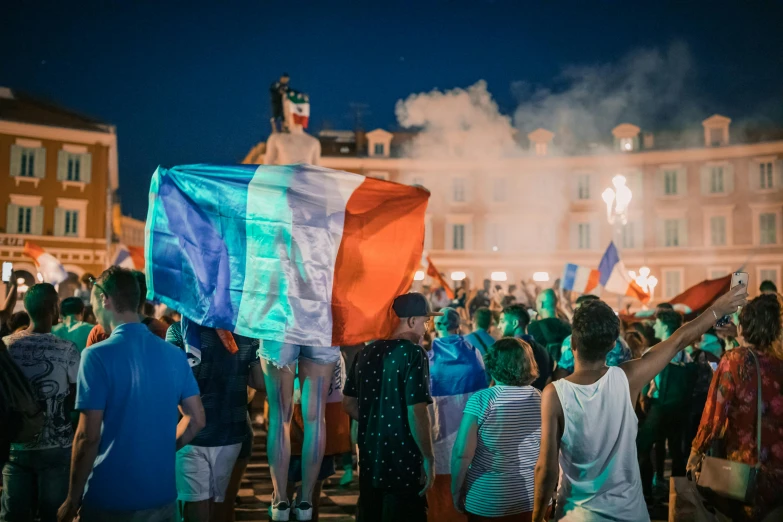 a group of people that are standing in the street, by Romain brook, pexels contest winner, figuration libre, french flag, orange and cyan lighting, square, rioting