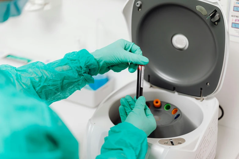 a person in blue gloves is cleaning a toilet, a microscopic photo, by Julia Pishtar, shutterstock, pathology sample test tubes, sitting on top of a cryopod, medical machinery, instagram post