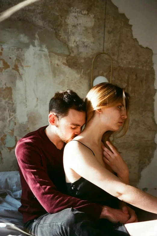 a man and a woman sitting on a bed, inspired by Nan Goldin, trending on pexels, renaissance, arm around her neck, valentin serov style, clemens ascher, embracing