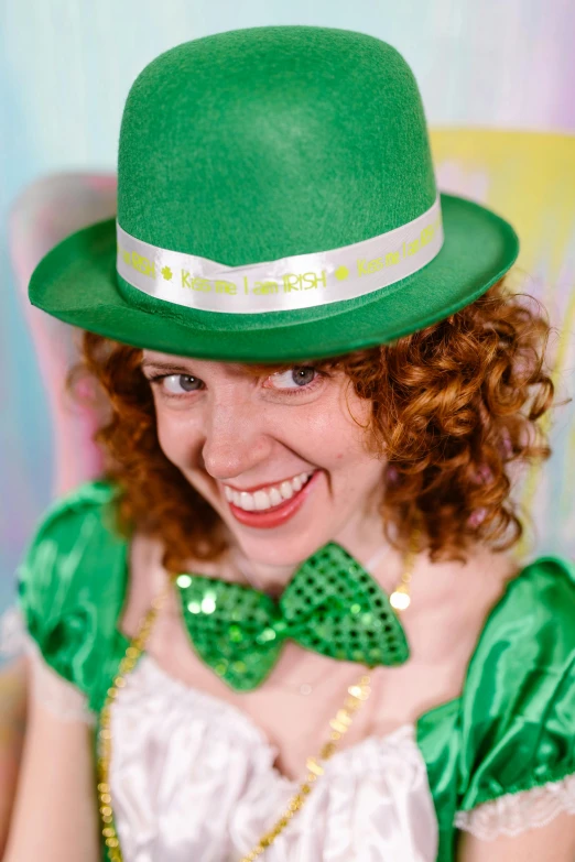 a woman wearing a green hat and a green bow tie, pots of gold, green and white, hr ginger, up close