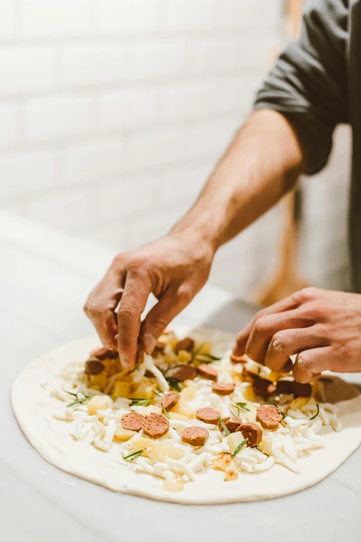 a close up of a person putting toppings on a pizza, by Robbie Trevino, chefs table, no - text no - logo, exploration, chopping hands