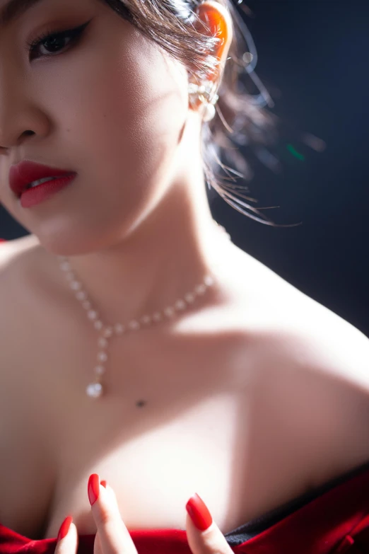 a woman in a red dress posing for a picture, an album cover, inspired by Gao Qipei, photorealism, opulent pearl necklace, detail shot, platinum jewellery, ethereal lighting - h 640