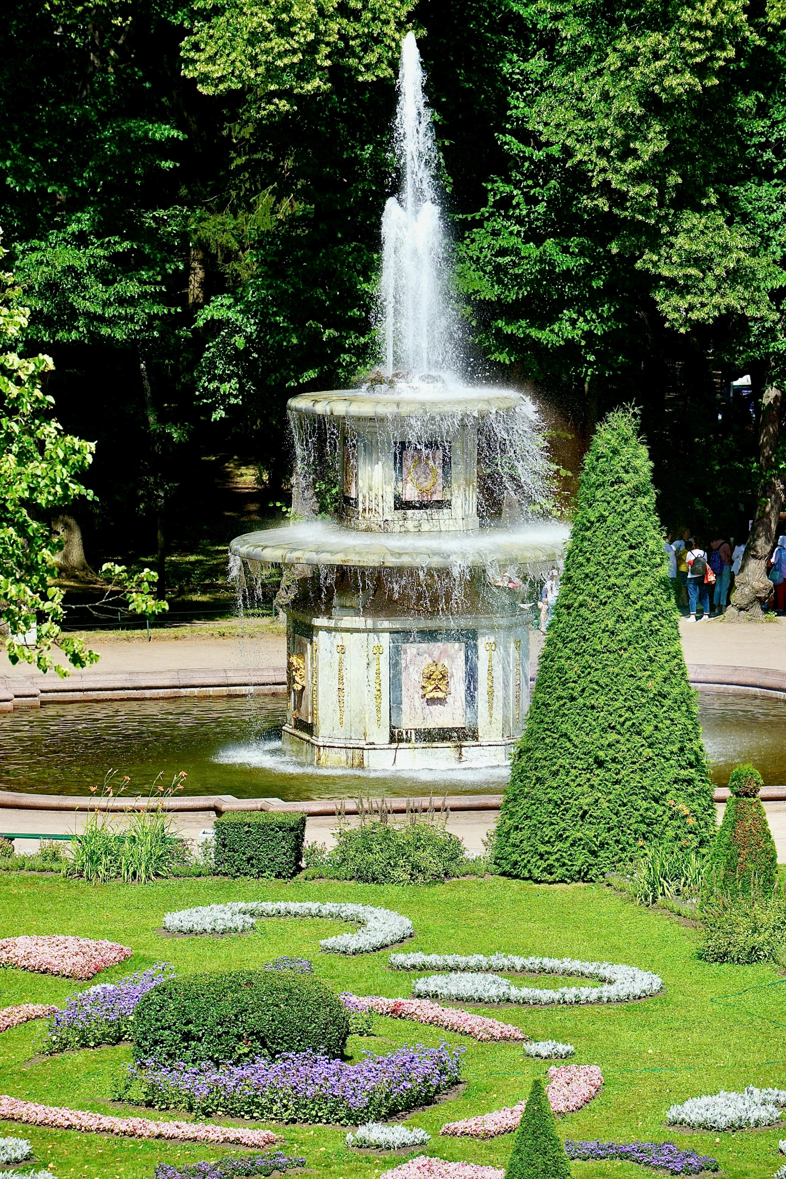 a fountain sitting in the middle of a lush green park, rococo, symbols, water swirling, best selling, lozhkin