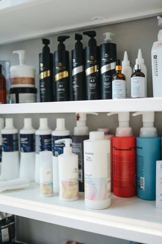 a shelf filled with lots of different types of hair products, by Daniel Lieske, product studio lighting, slide show, white wall coloured workshop, elliot anderson