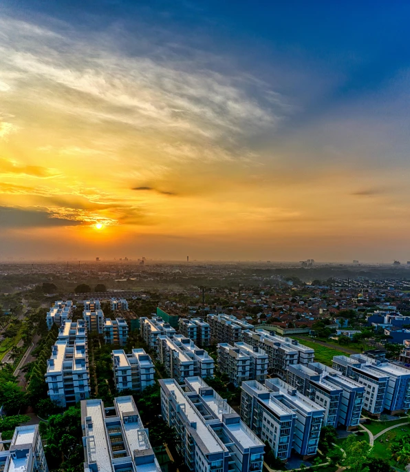 an aerial view of a city at sunset, by Basuki Abdullah, pexels contest winner, happening, sunset + hdri, bird\'s eye view, residential area, today\'s featured photograph 4k