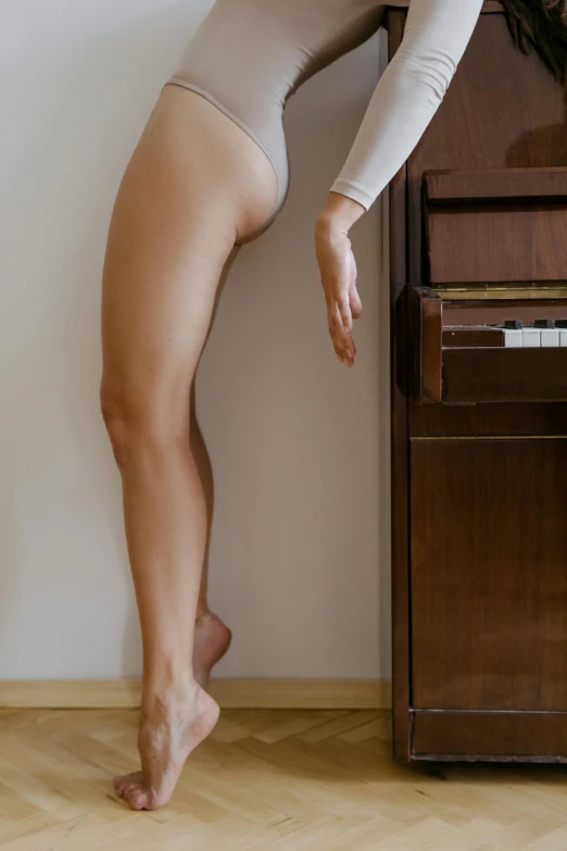 a woman standing in front of a piano, inspired by Elsa Bleda, aestheticism, exposed thighs!!!, 15081959 21121991 01012000 4k, concept photoset, perfect body