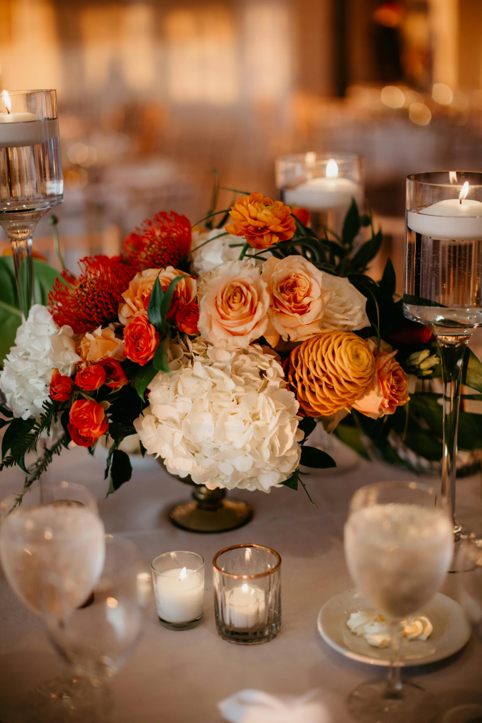 a bunch of candles sitting on top of a table, orange and white color scheme, abundant detail, lush flora, brightly lit