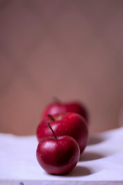 a group of red apples sitting on top of a table, by Alison Geissler, macro bokeh ”, maroon, ((portrait)), 15081959 21121991 01012000 4k
