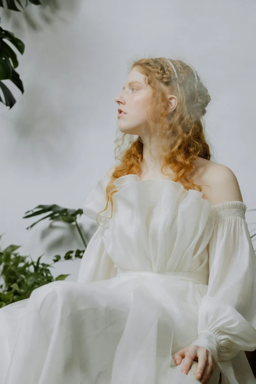 a woman in a white dress sitting on a chair, an album cover, inspired by Pierre Auguste Cot, unsplash, renaissance, sadie sink, wearing a wedding dress, botanical, detail shot