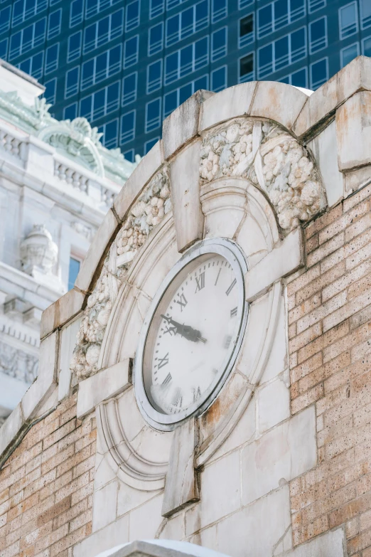 a clock that is on the side of a building, a photo, inspired by Childe Hassam, trending on unsplash, art nouveau, library of congress, detail structure, profile image, multiple stories