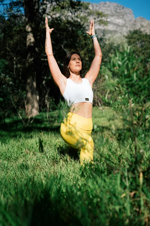 a woman in a white top and yellow pants doing yoga, unsplash, sydney park, avatar image, 3 5 mm photo, image