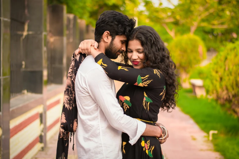 a man and a woman standing next to each other, pexels contest winner, wearing a kurta, romantic lead, profile image, square