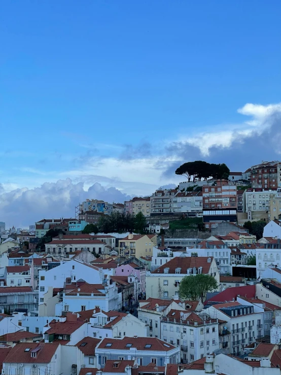 a view of a city from the top of a hill, lisbon, slide show, profile image