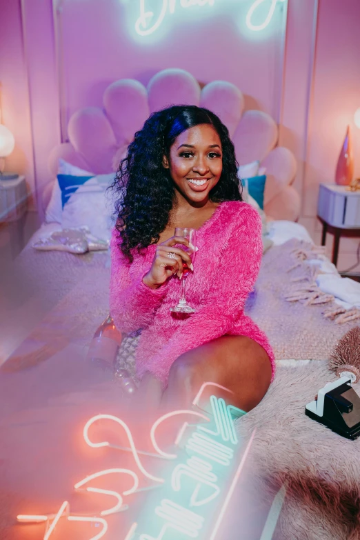 a woman sitting on a bed holding a glass of wine, an album cover, happening, teddy fresh, neon vibe, performing a music video, wavy