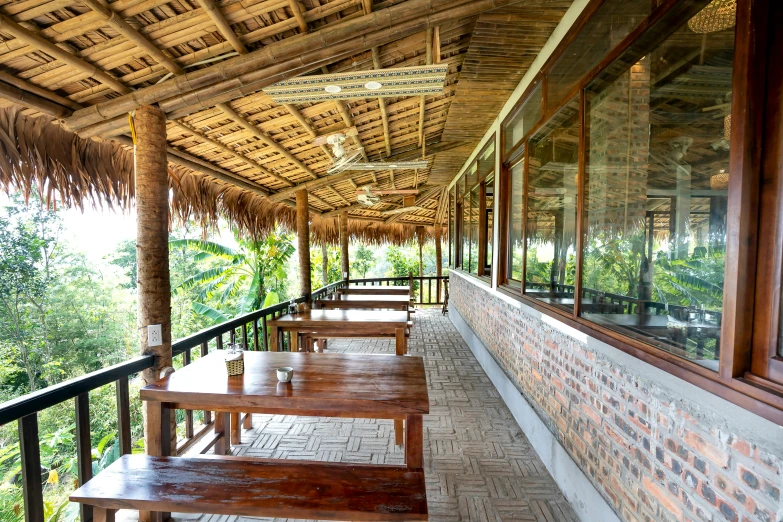 a row of benches sitting on the side of a building, party in jungles, bao phan, profile image, restaurant menu photo