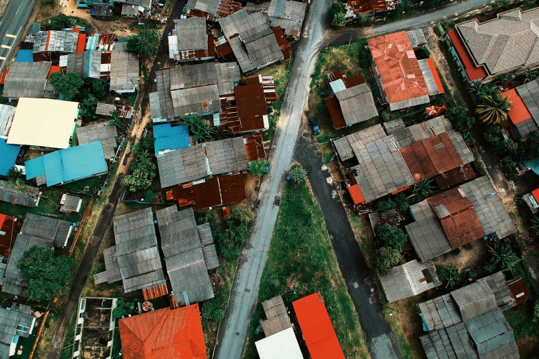 an aerial view of a city with lots of houses, unsplash, conceptual art, vietnam, square, brown, worn