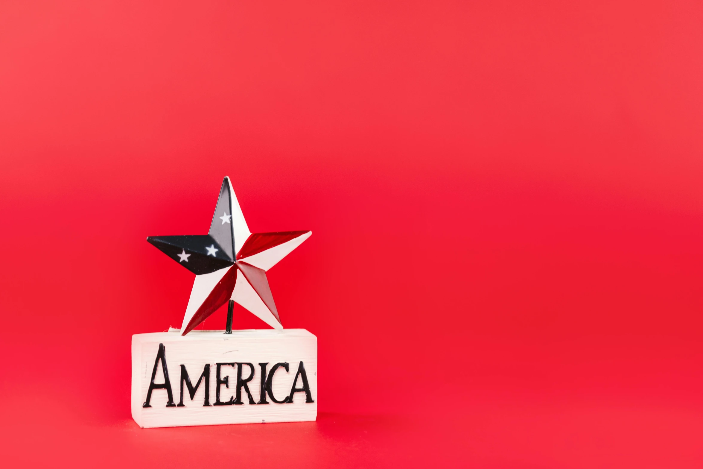 a star on top of a sign that says america, an album cover, shutterstock, american realism, plain red background, miniature product photo, ornament, independence