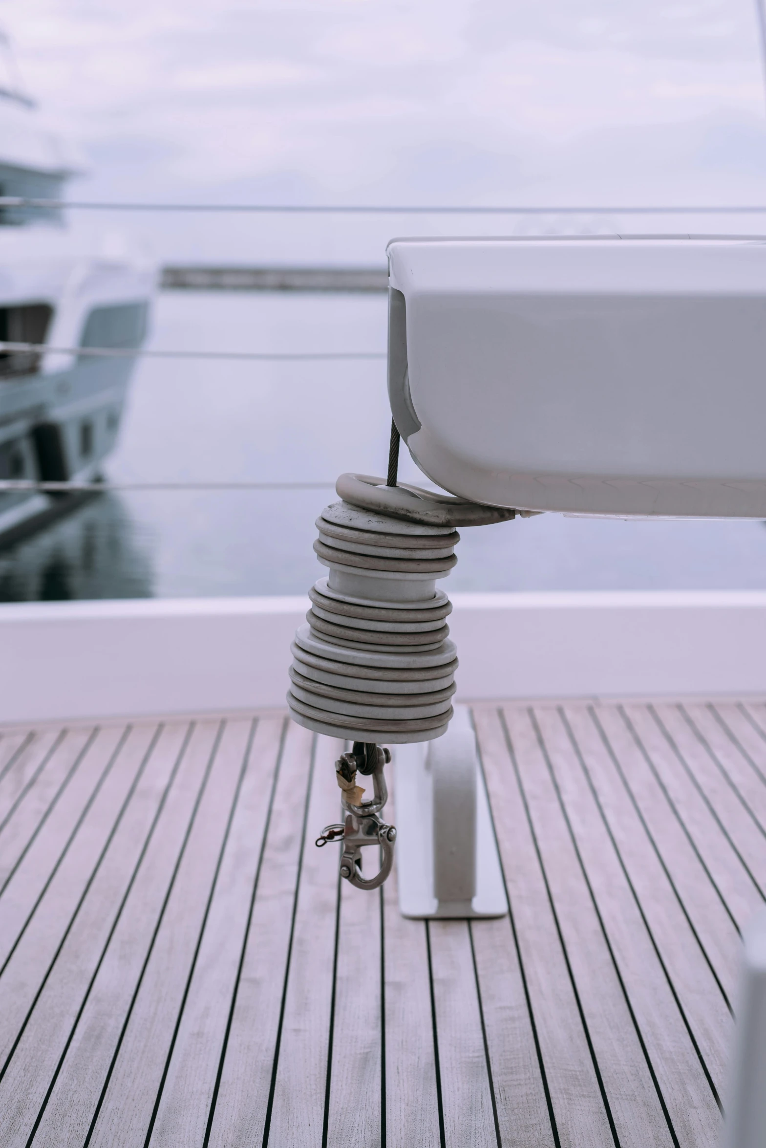 a close up of a boat on a body of water, levers, featuring rhodium wires, on a super yacht, hinged titanium legs
