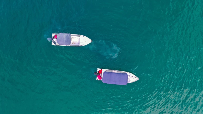 a couple of boats that are in the water, a digital rendering, pexels contest winner, hurufiyya, drones, abel tasman, awarding winning, serious business