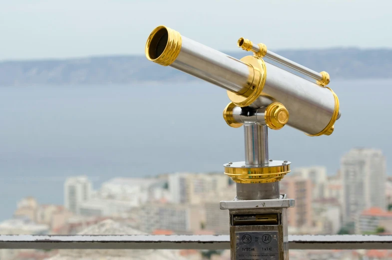 a telescope sitting on top of a metal pole, pexels contest winner, bauhaus, the sea seen behind the city, celestial regulator, laser beam ; outdoor, anamorpic lens