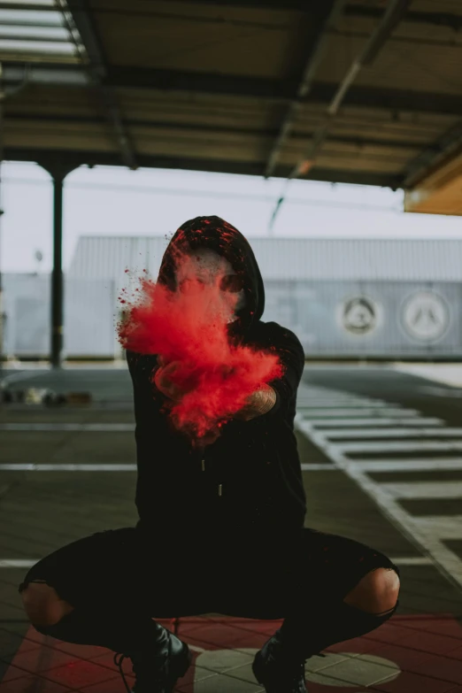 a person with red smoke in a parking lot, pexels contest winner, graffiti, holding hot sauce, sitting down, made of cotton candy, gif