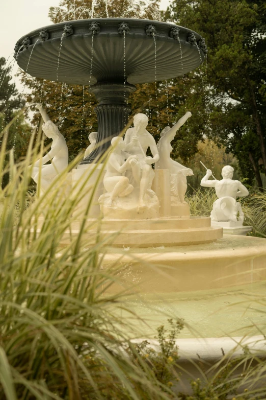 a fountain sitting in the middle of a lush green park, a marble sculpture, by Cherryl Fountain, camaraderie, “diamonds, ivory, napa