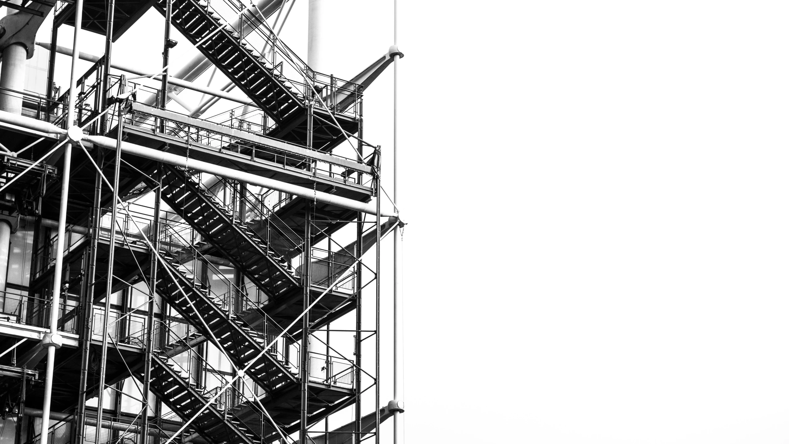 a black and white photo of a fire escape staircase, constructivism, on white, industrial colours, spire, 🧒 📸 🎨