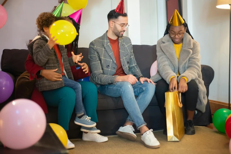 a group of people sitting on top of a couch, pexels contest winner, at a birthday party, avatar image, people shopping, lgbt